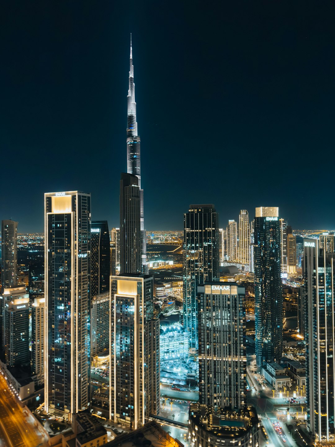 A view of a city at night from the top of a building